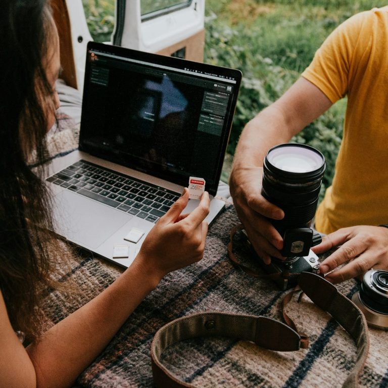 Personal Holiday Planning Couple planning a holiday together using a laptop